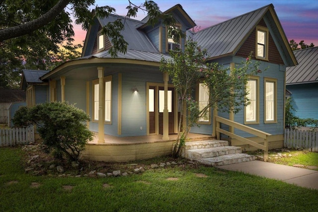 710 Gresham St, Smithville, TX 78957 - view of front facade with a porch and a metal roof