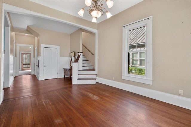 710 Gresham St, Smithville, TX 78957 - foyer with a chandelier, hardwood / wood-style floors, and stairs
