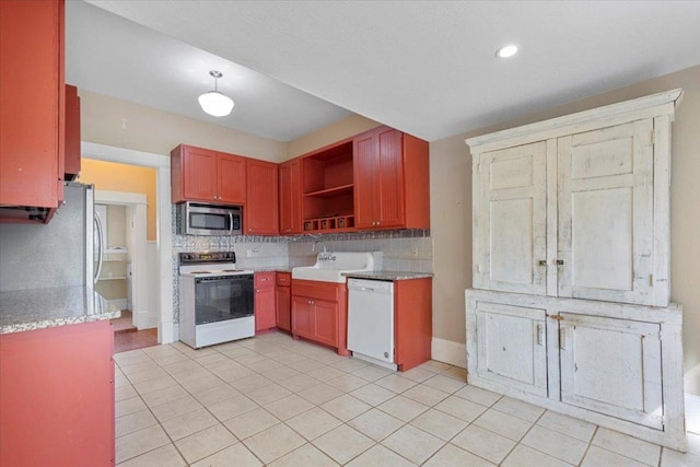 710 Gresham St, Smithville, TX 78957 - kitchen with white appliances, decorative backsplash, open shelves, and light tile patterned flooring