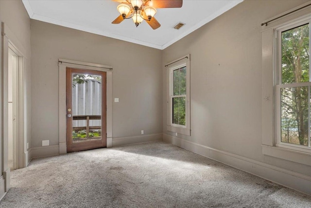 710 Gresham St, Smithville, TX 78957 - carpeted spare room with plenty of natural light, ceiling fan, and ornamental molding