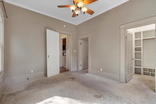 710 Gresham St, Smithville, TX 78957 - unfurnished bedroom with carpet floors, crown molding, and a ceiling fan