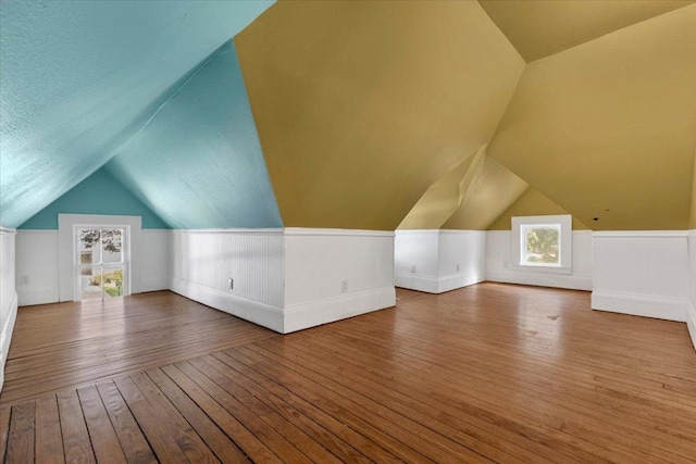 710 Gresham St, Smithville, TX 78957 - additional living space featuring hardwood / wood-style flooring and vaulted ceiling