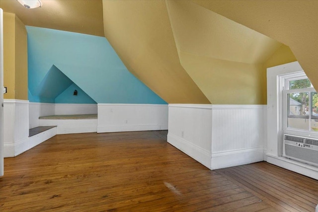 710 Gresham St, Smithville, TX 78957 - bonus room featuring wood-type flooring, lofted ceiling, and a wainscoted wall