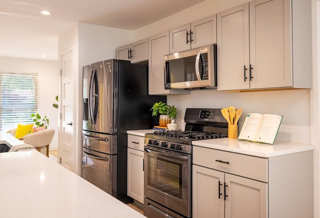 2306 Monarch Dr, Austin, TX 78748 - kitchen featuring appliances with stainless steel finishes, recessed lighting, and gray cabinets