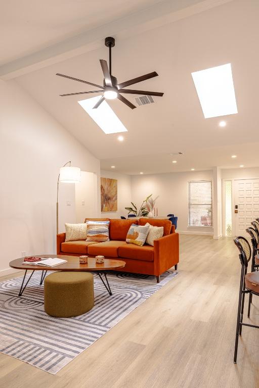 2306 Monarch Dr, Austin, TX 78748 - living room with a skylight, light wood-type flooring, a ceiling fan, and recessed lighting