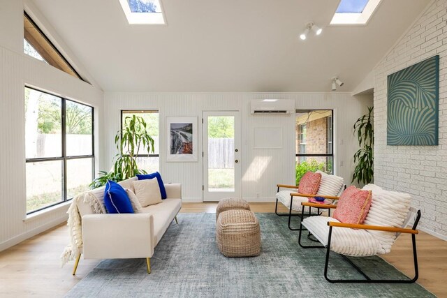 2306 Monarch Dr, Austin, TX 78748 - sunroom / solarium with a skylight, vaulted ceiling, plenty of natural light, and a wall mounted air conditioner