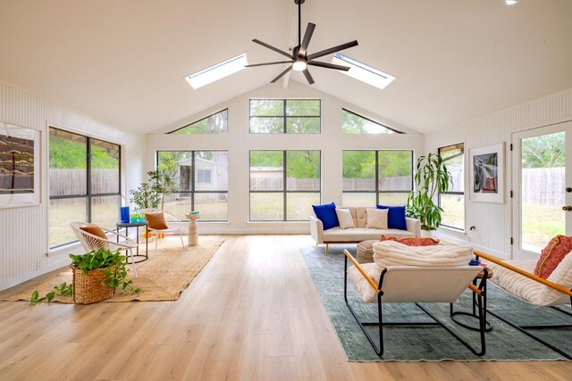 2306 Monarch Dr, Austin, TX 78748 - sunroom / solarium featuring a skylight, lofted ceiling, plenty of natural light, and wood finished floors