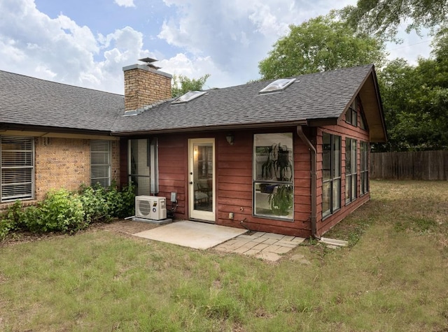 2306 Monarch Dr, Austin, TX 78748 - back of property with a shingled roof, a chimney, and a patio area
