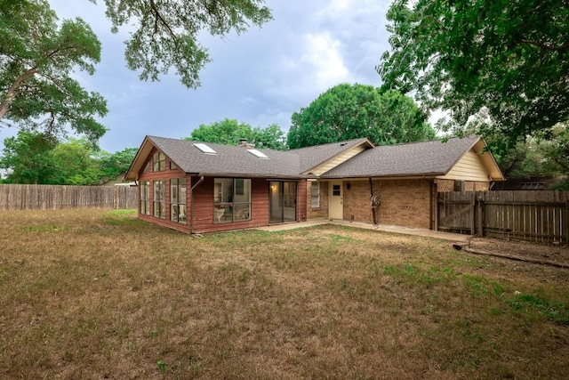 2306 Monarch Dr, Austin, TX 78748 - back of house featuring a fenced backyard, a chimney, and brick siding