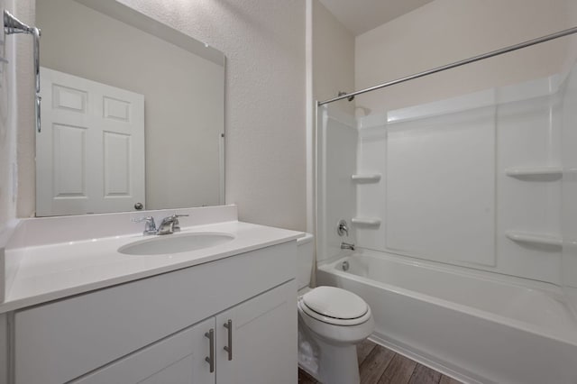 241 Pivot Dr, Taylor, TX 76574 - bathroom with vanity, wood finished floors, and tub / shower combination