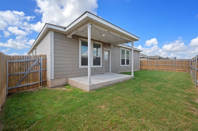 241 Pivot Dr, Taylor, TX 76574 - rear view of house featuring a patio and a fenced backyard