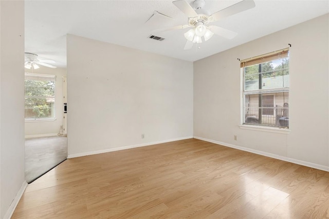 5708 Garden Oaks Dr, Austin, TX 78745 - unfurnished room featuring a ceiling fan, light wood-type flooring, and healthy amount of natural light