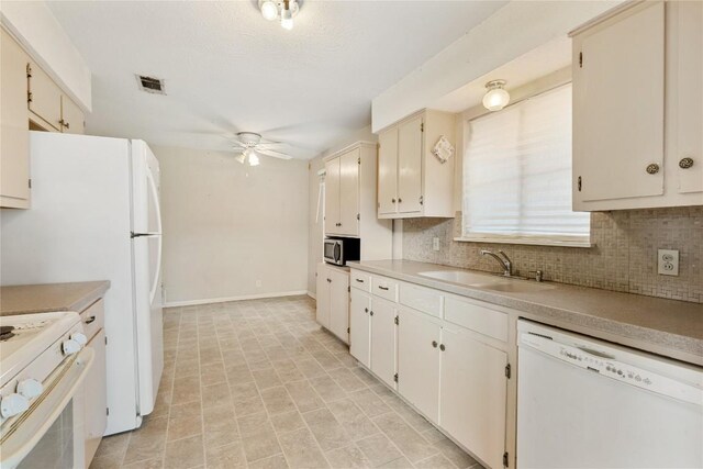 5708 Garden Oaks Dr, Austin, TX 78745 - kitchen with white appliances, a ceiling fan, tasteful backsplash, and light countertops