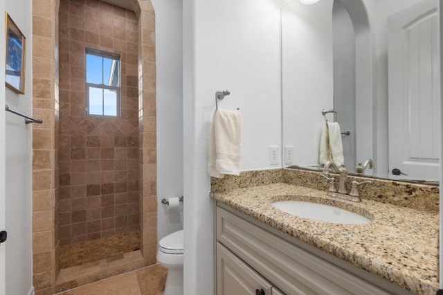 1006 Foothills Dr, Dripping Springs, TX 78620 - bathroom with vanity, a tile shower, and tile patterned floors