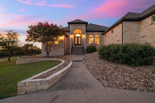 1006 Foothills Dr, Dripping Springs, TX 78620 - view of front of house with a yard and stone siding