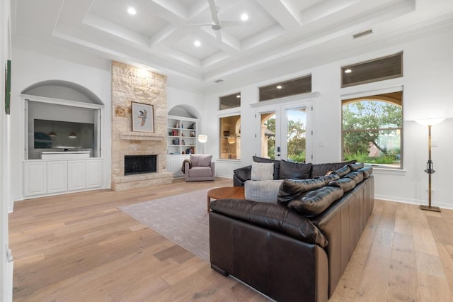 1006 Foothills Dr, Dripping Springs, TX 78620 - living room with light wood finished floors, a fireplace, built in features, recessed lighting, and coffered ceiling