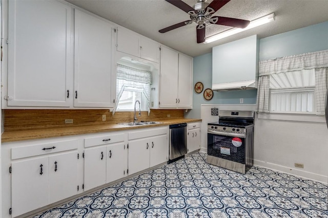 1106 S 11th St, Temple, TX 76504 - kitchen featuring stainless steel appliances, white cabinets, a ceiling fan, and light countertops