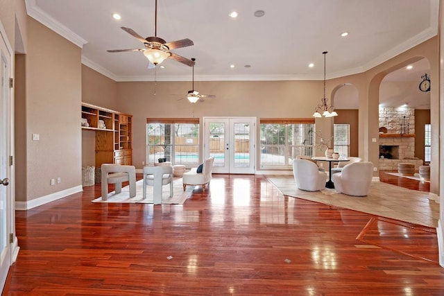 1806 Carey Ave, Taylor, TX 76574 - dining area with a ceiling fan, healthy amount of natural light, ornamental molding, a fireplace, and hardwood / wood-style floors