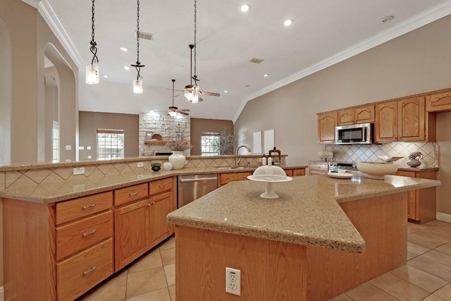 1806 Carey Ave, Taylor, TX 76574 - kitchen with stainless steel appliances, ceiling fan, a spacious island, crown molding, and backsplash