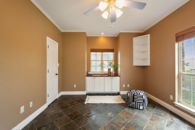 1806 Carey Ave, Taylor, TX 76574 - interior space with stone tile flooring, crown molding, healthy amount of natural light, and ceiling fan