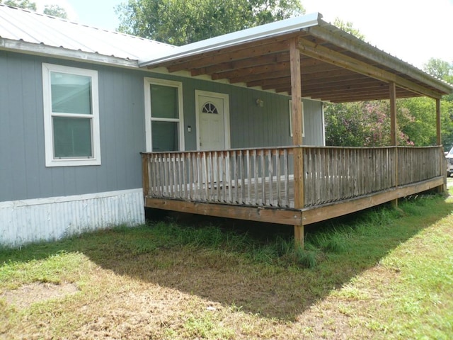 502 Ross St, Smithville, TX 78957 - doorway to property featuring a deck and a metal roof