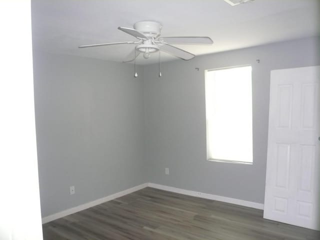 502 Ross St, Smithville, TX 78957 - unfurnished room with a ceiling fan and dark wood finished floors