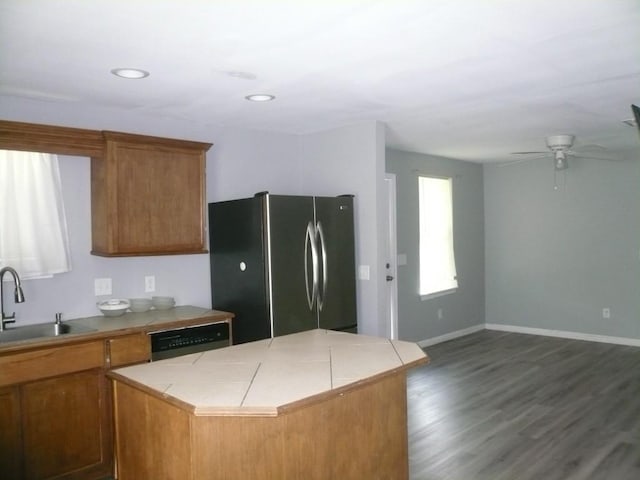 502 Ross St, Smithville, TX 78957 - kitchen featuring stainless steel appliances, brown cabinets, a center island, a ceiling fan, and recessed lighting