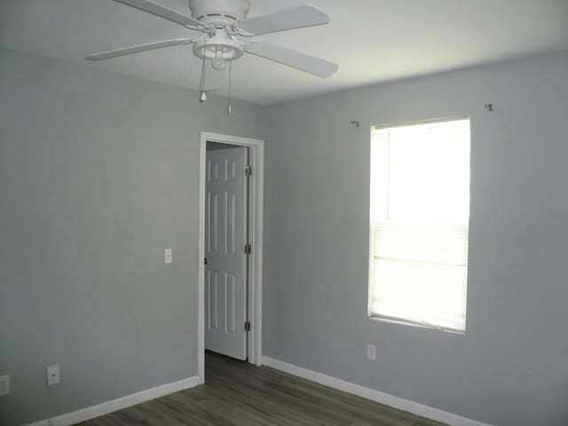 502 Ross St, Smithville, TX 78957 - spare room with healthy amount of natural light, wood finished floors, and ceiling fan