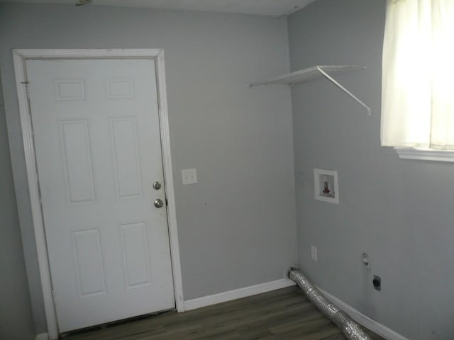 502 Ross St, Smithville, TX 78957 - washroom featuring washer hookup, electric dryer hookup, and dark wood-style flooring