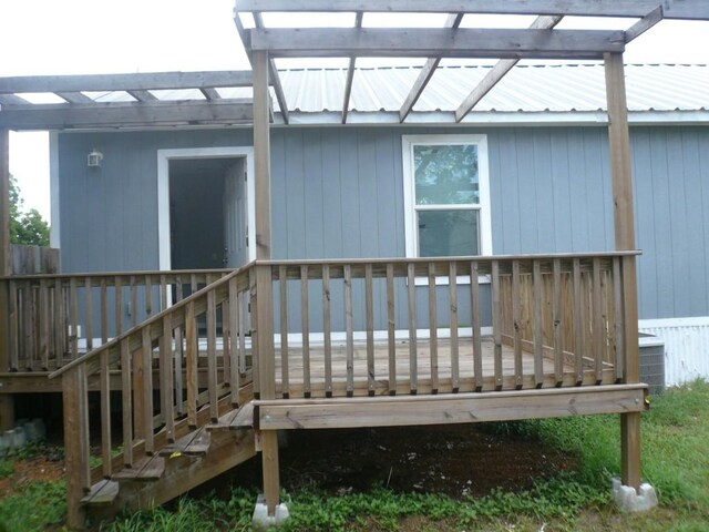 502 Ross St, Smithville, TX 78957 - doorway to property with a deck and a metal roof