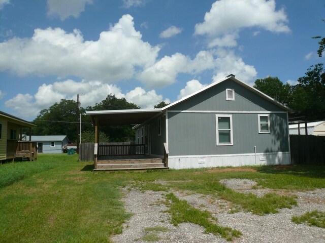 502 Ross St, Smithville, TX 78957 - back of house featuring a yard