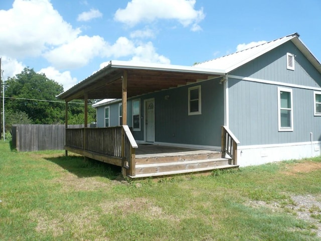 502 Ross St, Smithville, TX 78957 - back of house featuring a yard