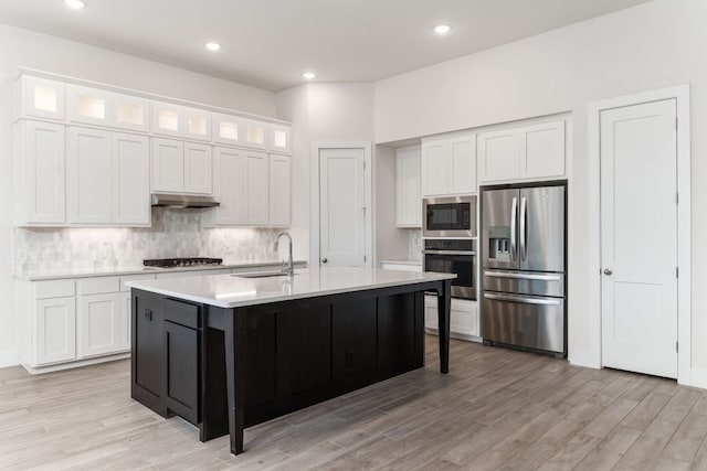 2935 Mckinnie Park, Bulverde, TX 78163 - kitchen with stainless steel appliances, light countertops, white cabinetry, backsplash, and recessed lighting