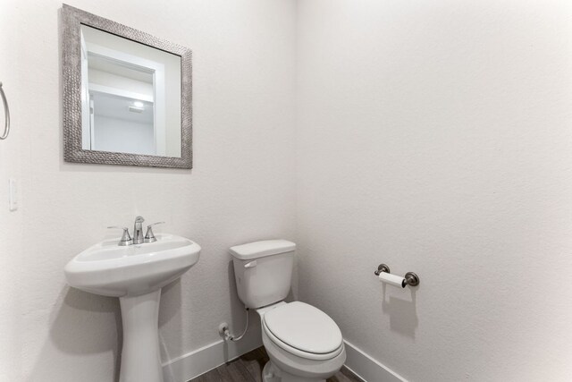 2935 Mckinnie Park, Bulverde, TX 78163 - bathroom featuring toilet and wood finished floors