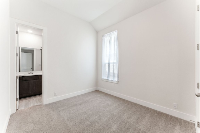 2935 Mckinnie Park, Bulverde, TX 78163 - unfurnished bedroom with carpet, ensuite bath, and vaulted ceiling