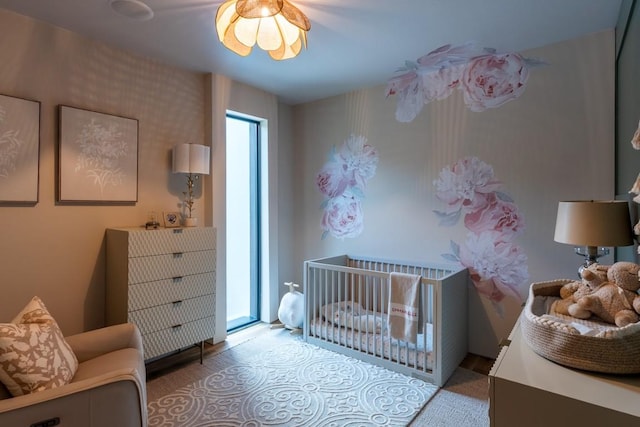 1001 Madrone Rd, West Lake Hills, TX 78746 - bedroom with a crib and wood finished floors