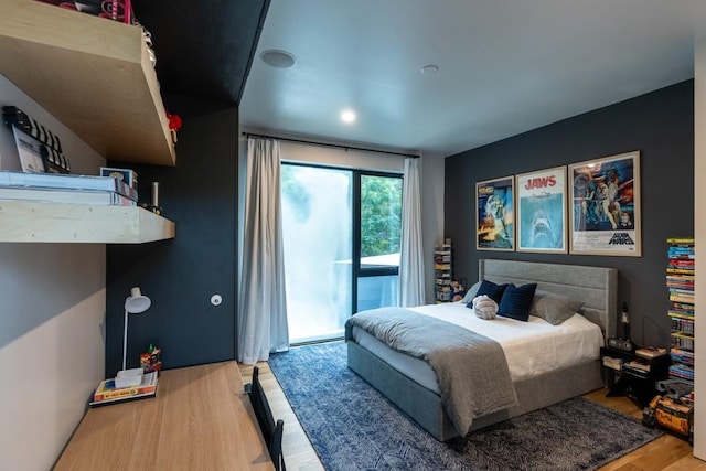 1001 Madrone Rd, West Lake Hills, TX 78746 - bedroom with access to outside and wood finished floors