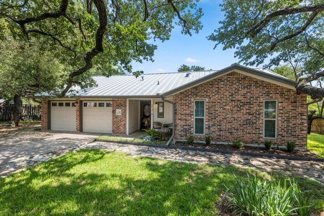 225 Spanish Oak Dr, Georgetown, TX 78628 - ranch-style home with an attached garage, brick siding, and driveway