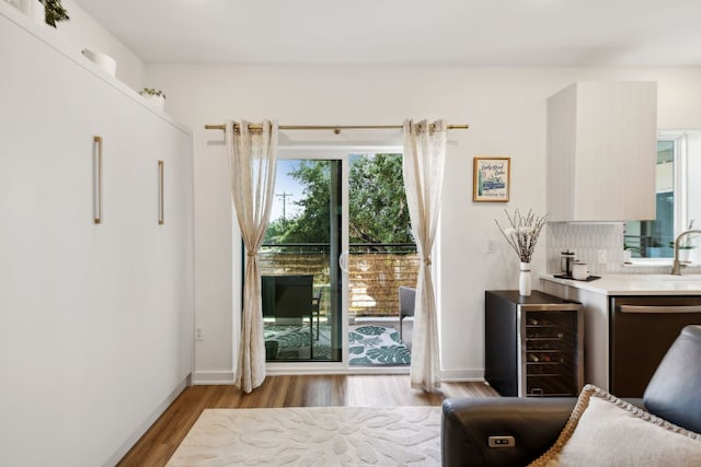 4802 S Congress Ave Unit 215, Austin, TX 78745 - sitting room featuring wood finished floors and wine cooler