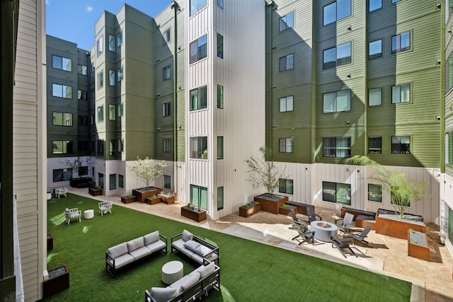 4802 S Congress Ave Unit 215, Austin, TX 78745 - view of home's community featuring a patio, an outdoor fire pit, and a yard