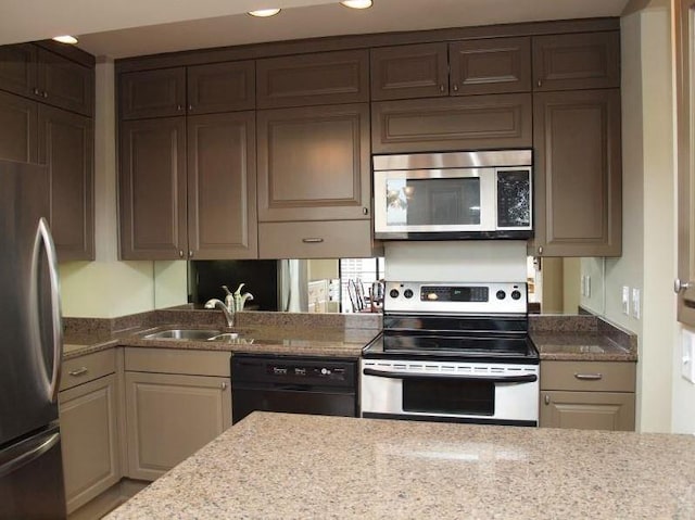 1122 Colorado St Unit 2001, Austin, TX 78701 - kitchen with stainless steel appliances, light stone counters, and recessed lighting