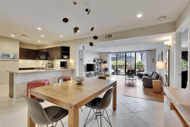 40 N Interstate 35 Hwy Unit 5B2, Austin, TX 78701 - dining space with light tile patterned floors and recessed lighting