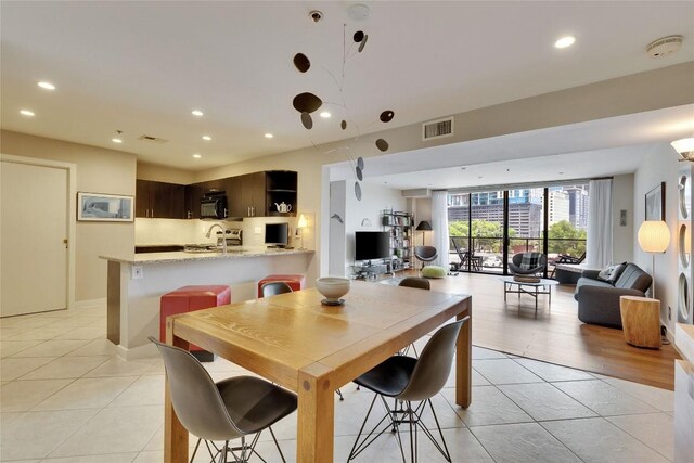 40 N Interstate 35 Hwy Unit 5B2, Austin, TX 78701 - dining area with light tile patterned floors and recessed lighting