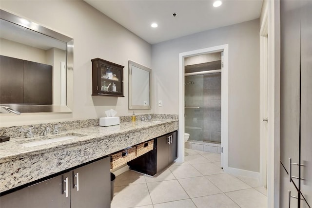 40 N Interstate 35 Hwy Unit 5B2, Austin, TX 78701 - full bath with double vanity, a shower stall, tile patterned floors, and recessed lighting