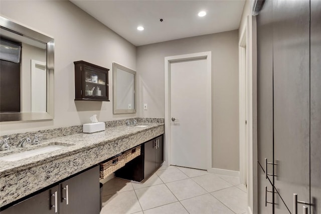 40 N Interstate 35 Hwy Unit 5B2, Austin, TX 78701 - full bathroom with double vanity, tile patterned flooring, and recessed lighting