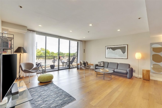 40 N Interstate 35 Hwy Unit 5B2, Austin, TX 78701 - living area with light wood-style flooring, floor to ceiling windows, and recessed lighting