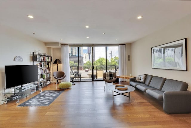 40 N Interstate 35 Hwy Unit 5B2, Austin, TX 78701 - living area with a wall of windows, wood finished floors, and recessed lighting