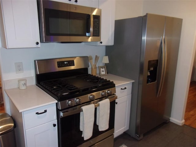 905 W Live Oak St, Austin, TX 78704 - kitchen with stainless steel appliances, light countertops, and white cabinets