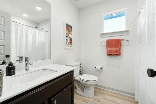 7713 Saddle Up Dr, Austin, TX 78724 - bathroom featuring wood finished floors, vanity, a shower with shower curtain, and recessed lighting