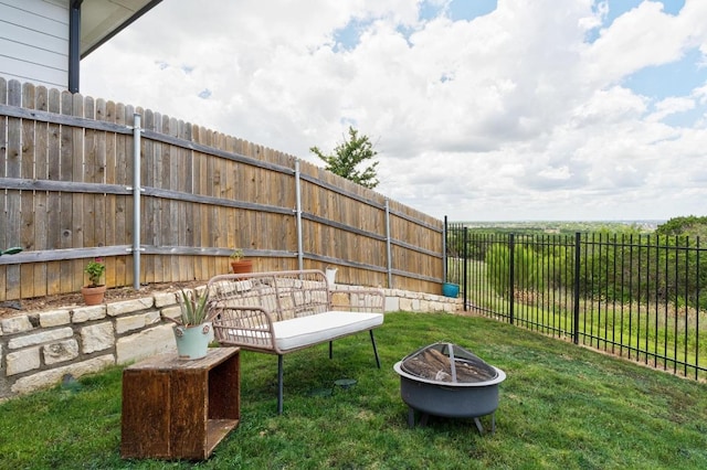 7713 Saddle Up Dr, Austin, TX 78724 - fenced backyard featuring a fire pit
